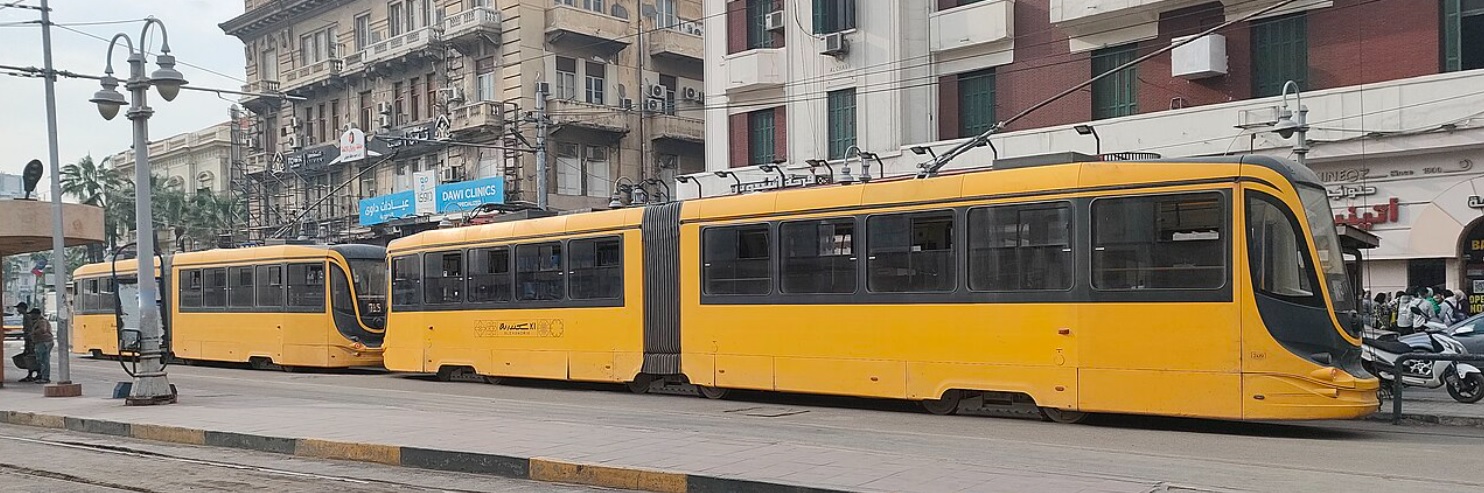 Modern yellow tram at El Raml station for public transport in Alexandria.