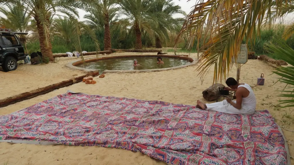 Visit Bir Wahid from Siwa Oasis desert camping tour