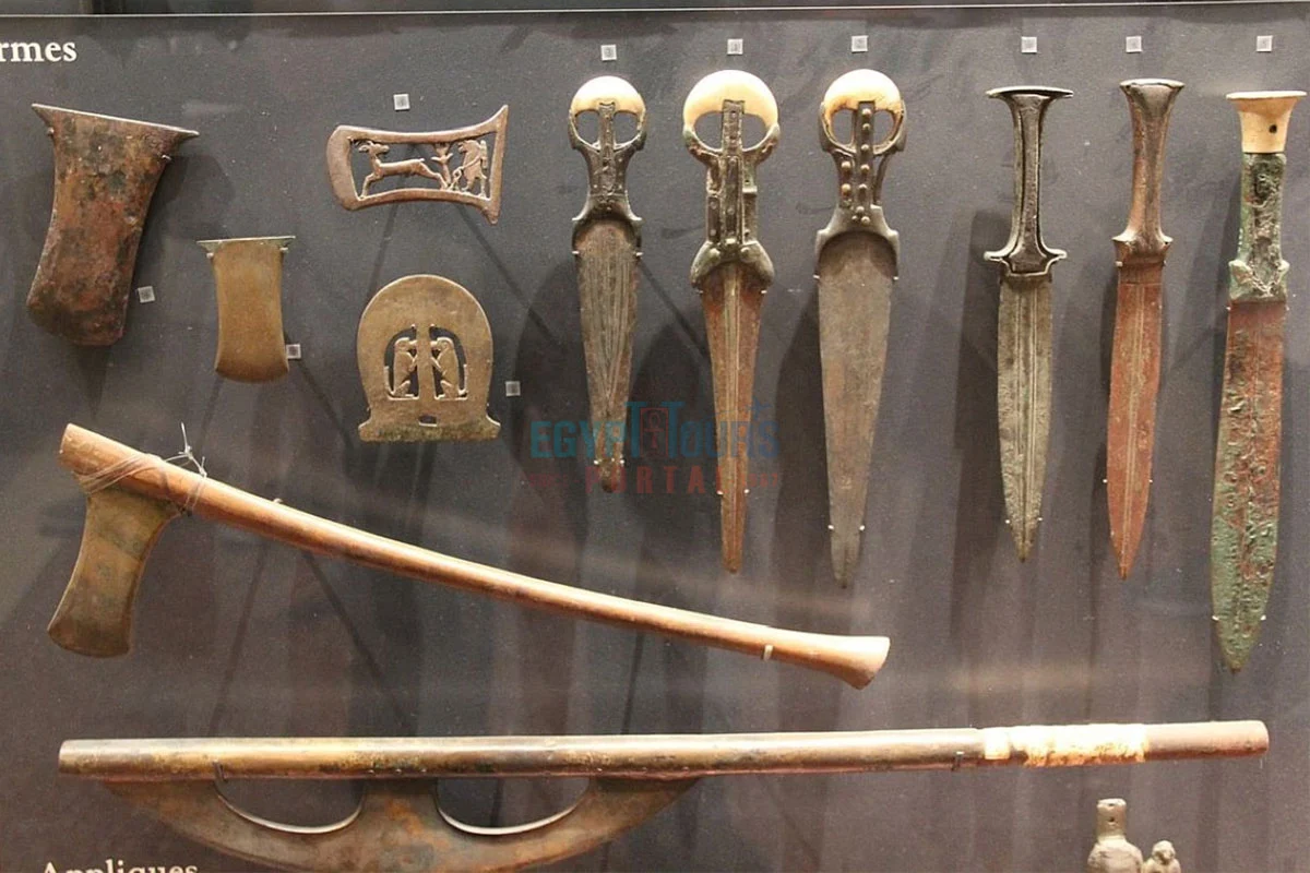 Ancient Egyptian weapons including swords, axes, and spears