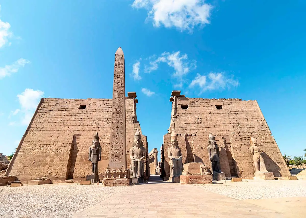 Luxor Temple in Egypt featuring ancient Egyptian columns, statues and historic architecture