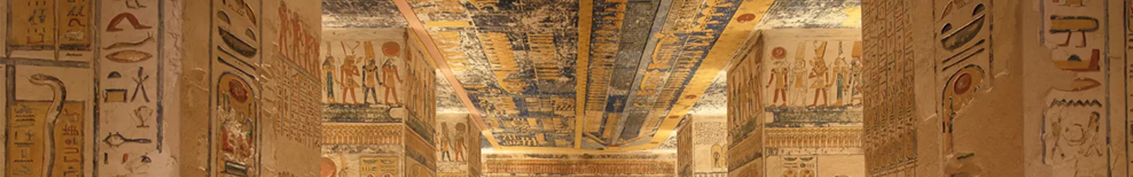 Colorful ancient carvings and painted ceiling inside Abu Sinbel temple