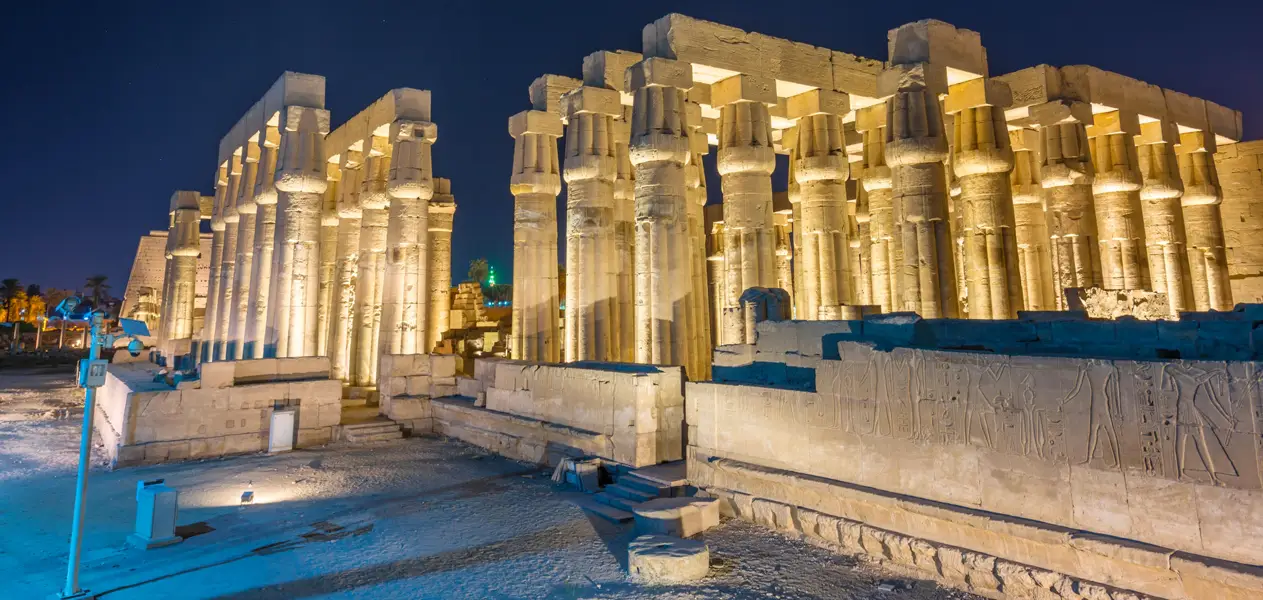Illuminated columns of Karnak Temple Great Hypostyle Hall in Luxor at night, Egypt