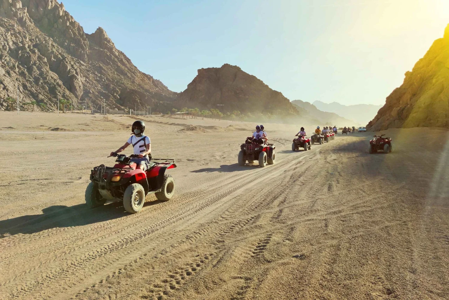 ATV riders exploring the Sinai desert with mountain views