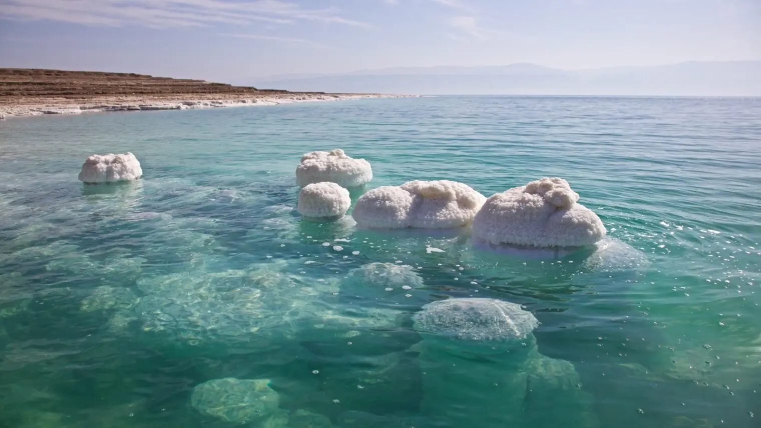 Tourist enjoying the famous Dead Sea floating experience in Jordan