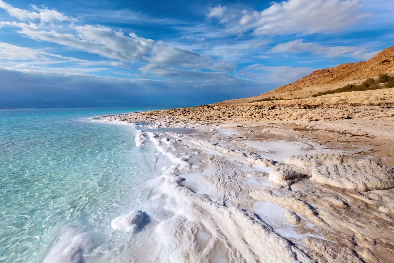 The Dead Sea in Jordan with crystal blue waters and mountain views