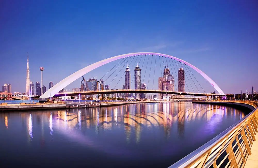 Scenic view of Dubai Water Canal surrounded by skyscrapers and waterfront attractions