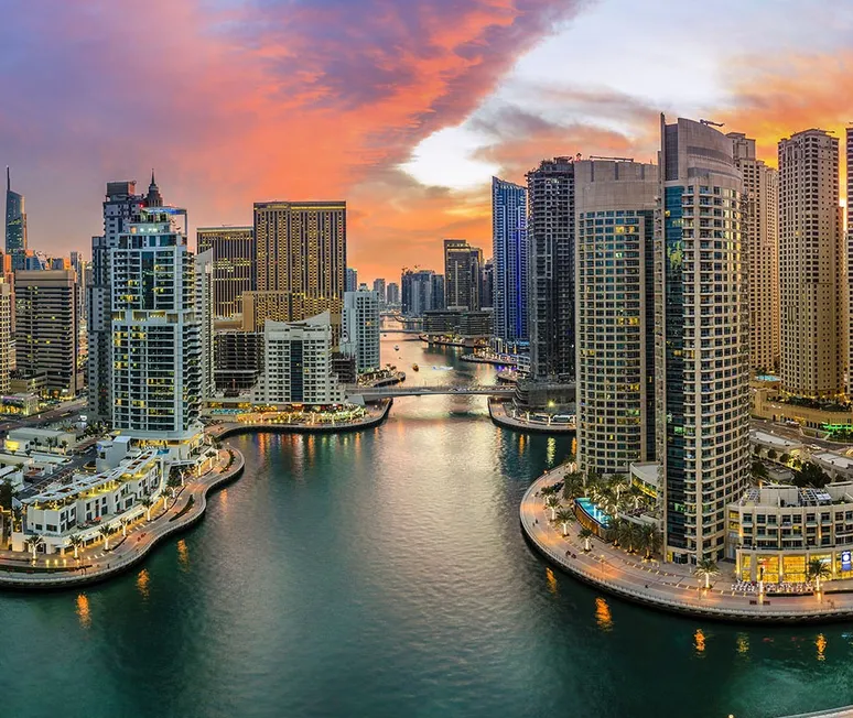 Aerial view of Dubai Marina skyline featuring luxury towers and yachts