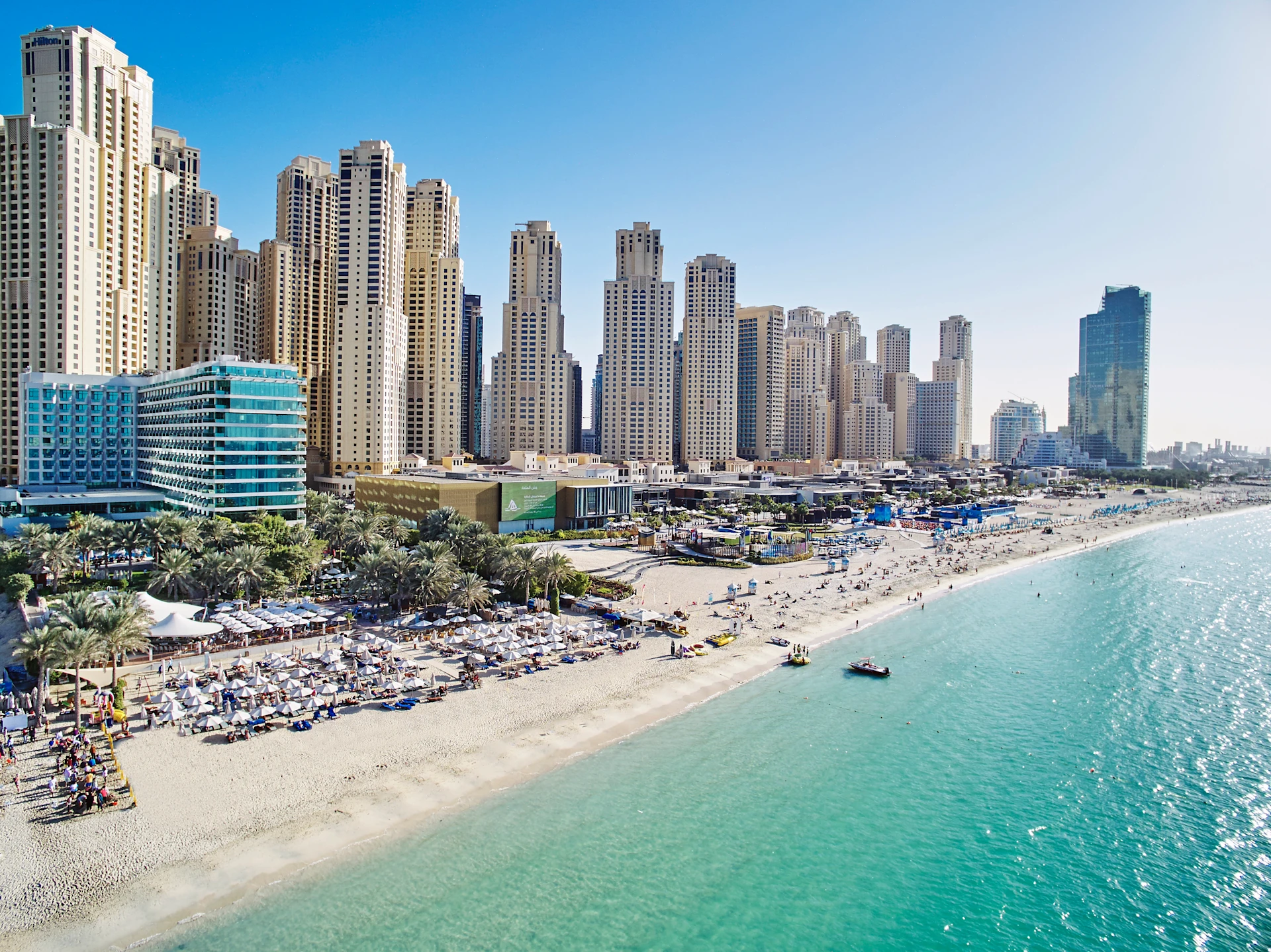 Jumeirah Beach in Dubai with clear blue water and skyline view