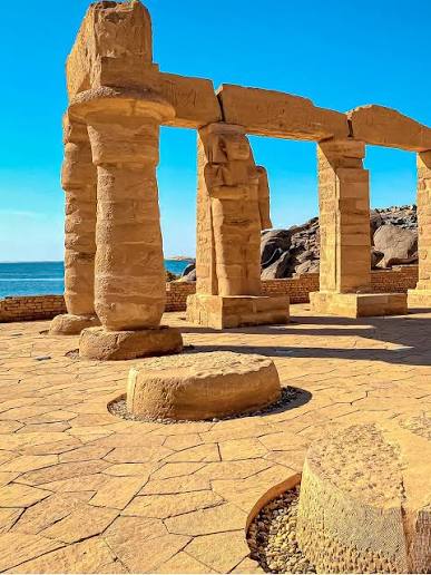 Ancient sandstone columns and courtyard of Kalabsha Temple in Aswan, Egypt.