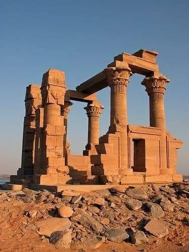 Ancient sandstone ruins and towering columns of Kalabsha Temple in Aswan, Egypt.
