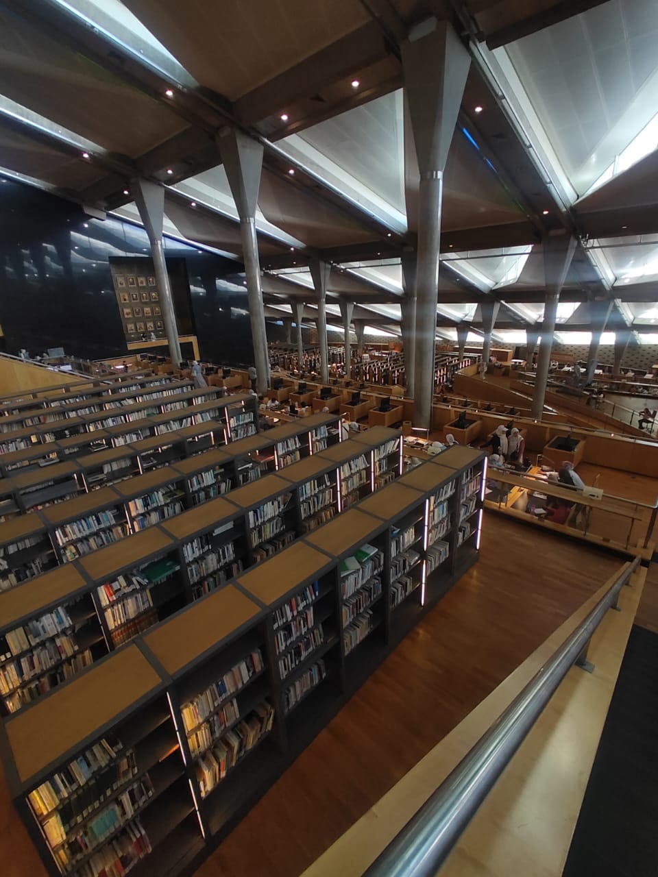 Bibliotheca Alexandrina reading hall in Alexandria, Egypt, with rows of bookshelves