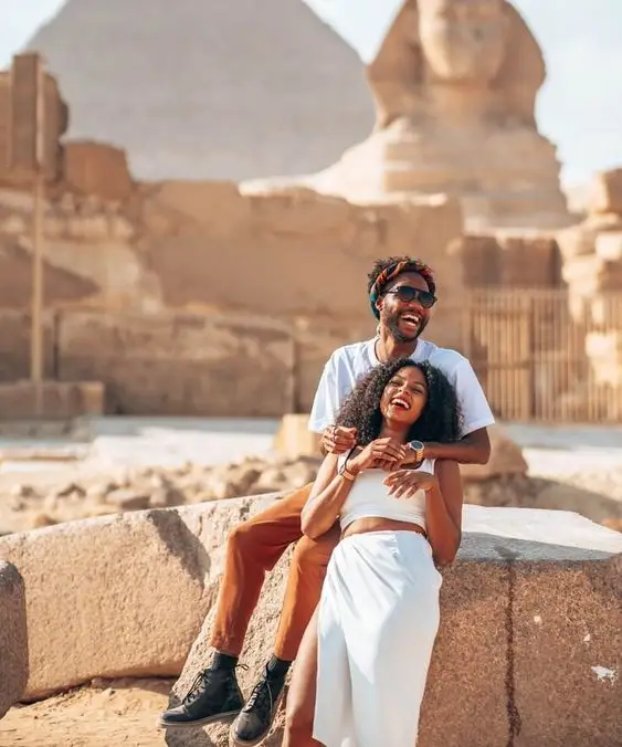 Couple visiting the Giza Necropolis in Egypt
